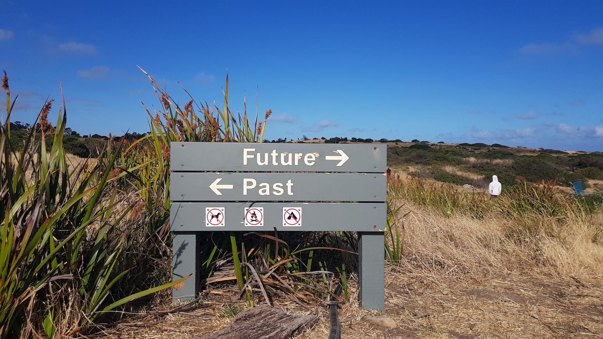 wooden signage saying future and past