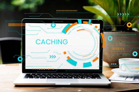 Laptop screen shows caching