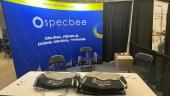 Specbee's Booth at DrupalCon Pittsburgh 2023 with Free GymBags to Distribute as Drupal Swag